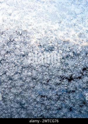 frost on home window glass close up on cold winter dusk Stock Photo