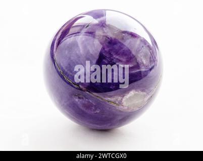 polished ball from natural charoite gemstone on white background from Sakha Republic, Siberia, Russia Stock Photo