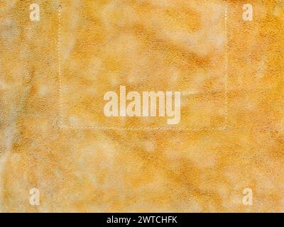 textured background from natural yellow suede close up Stock Photo