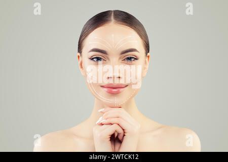 Perfect fashion model face close up. Medicine, facial treatment, massage and plastic surgery concept Stock Photo