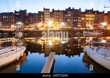 HONFLEUR, FRANCE - MAY4, 2018:Waterfront reflection of traditional houses in Honfleur, Normandy, France Stock Photo