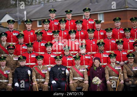 Regimental Lieutenant Colonel, Major General Sir Christopher Ghika, (fourth left) and his wife, Lady Ghika, posing with members of the Irish Guards for a family picture at Mons Barracks, Aldershot, following a St Patrick's Day parade. Picture date: Sunday March 17, 2024. Stock Photo