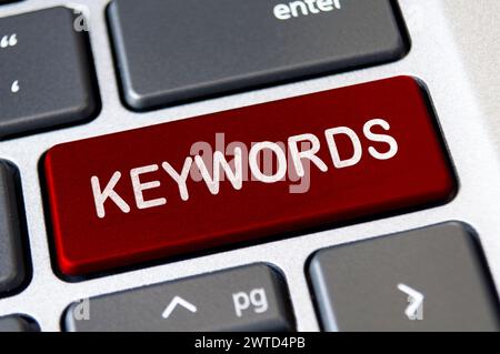 Keywords text on red laptop keyboard button. Lead generation and keywords search concept. Stock Photo