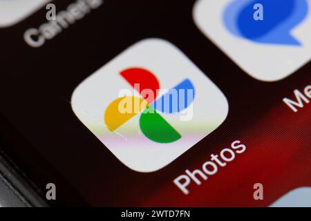 Google photos app icon on mobile phone Stock Photo