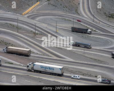 Single swings, trucks on winding road, mountain pass Los Caracoles, The Snails, road connecting Chile and Argentina, aerial view, Chile Stock Photo