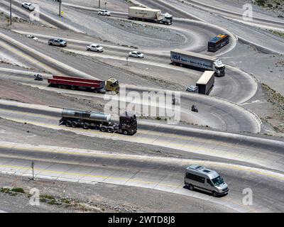 Single swings, trucks on winding road, mountain pass Los Caracoles, The Snails, road connecting Chile and Argentina, aerial view, Chile Stock Photo