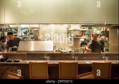 Chefs working in an open kitchen at Sensi restaurant, Bellagio in Las Vegas, Nevada Stock Photo