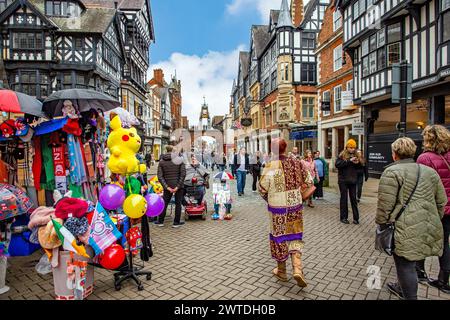 Shoppers  in the Roman town of Chester England shopping in Eastgate Street with a view of the Eastgate clock Stock Photo