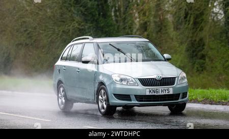 Milton Keynes,UK-Mar 17th 2024: 2011 Skoda Fabia car driving in the rain Stock Photo