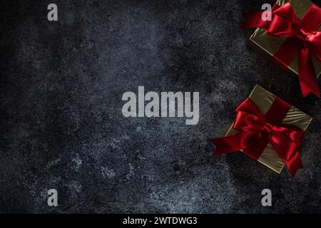Two Golden Gift Boxes On Dark Background With Copy Space Stock Photo