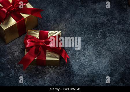 Golden Gift Boxes  On Dark Background Stock Photo