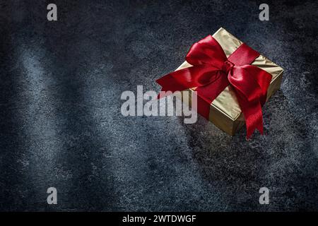 Square Golden Gift Box On Dark Background Stock Photo