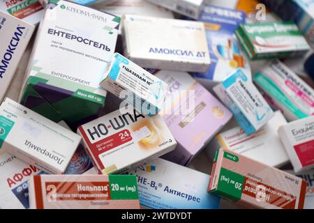 KYIV, UKRAINE - NOVEMBER 27, 2023 Many boxes of pills and capsules stacked in pharmacy drug store close up Stock Photo