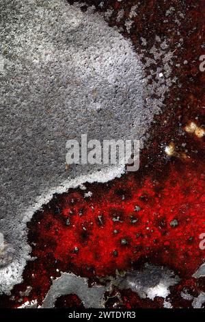 A close-up of a red and black Pottery Glacing Stock Photo
