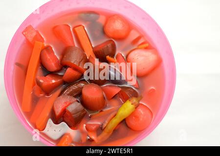 marinated vegetables (Torshi) or mixed pickled vegetables of sliced cucumbers, carrots, beets, turnips, onions, red peppers and salt, Egyptian appetiz Stock Photo