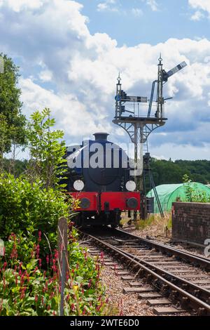 Hunslet ‘Austerity’ WD192 ‘Waggoner’ steam locomotive approaching Havenstreet station on the Isle of Wight Steam Railway, Isle of Wight, England, UK Stock Photo