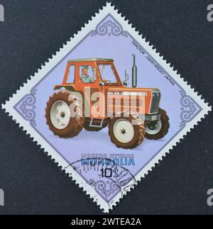 Cancelled postage stamp printed by Mongolia, that shows Iseki-6500 Tractor, Japan, circa 1982. Stock Photo