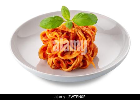 Tagliatelle egg pasta with tomato sauce  and basil leaves in white plate isolated on white with clipping path included Stock Photo