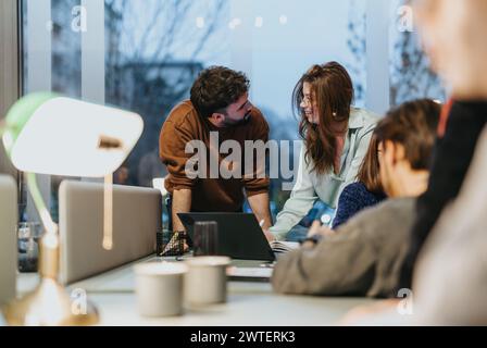 Young team collaborating on innovative solutions for business growth. Stock Photo
