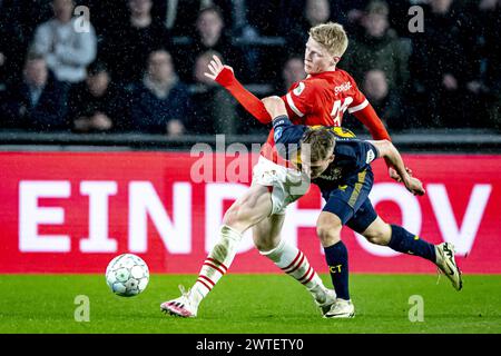 EINDHOVEN, Netherlands. 17th Mar, 2024. football, Philips stadium, Dutch eredivisie, season 2023/2024, during the match PSV - Twente, PSV player Jerdy Schouten, FC Twente player Michal Sadilek Credit: Pro Shots/Alamy Live News Stock Photo