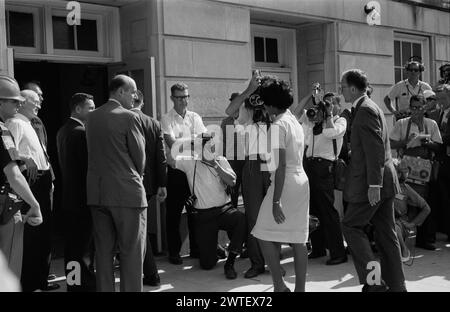 African-American university student Vivian Malone entering the University of Alabama in the U.S. to register for classes as one of the first African-American students to attend the institution. Until 1963, the university was racially segregated and African-American students were not allowed to attend. Stock Photo
