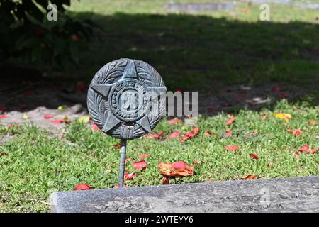 A WWI bronze star by a grave in the historic cemetery behind the Holy Trinity Episcopal Church in rural Hertford, North Carolina. Stock Photo