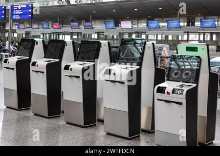 Frankfurt Airport, Germany - February 19, 2024: several self-service check-in automats at the Frankfurt International Airport Stock Photo