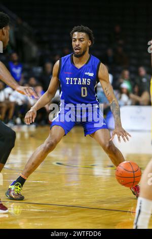 London, Canada. 17th Mar, 2024. London Ontario Canada. March 17 2024, The London Lightning defeat the Kitchener Titans 118-114 in regulation on St. Patrick's Day. Curtis Hollis (0) of Kitchener Titans comes down the court with the ball. Credit: Luke Durda/Alamy Live News Stock Photo