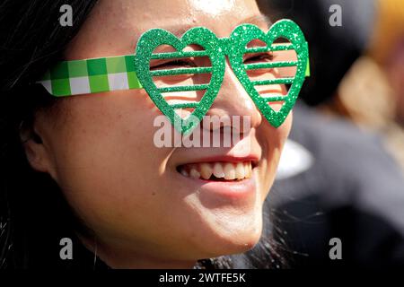 Toronto, Canada. 17th Mar, 2024. A spectator is watching the St. Patrick's Day Parade along Bloor Street in downtown Toronto, Canada, on March 17, 2024. (Photo by Mike Campbell/NurPhoto) Credit: NurPhoto SRL/Alamy Live News Stock Photo