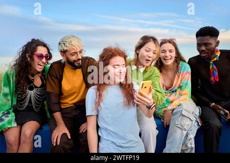 Group of young teenagers using cell phones. Concept of technology, connection. Stock Photo