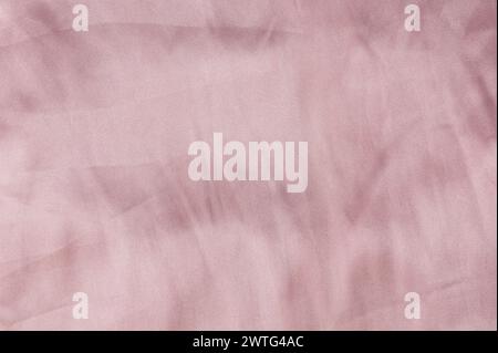 Pink color satin cloth texture background macro close up view Stock Photo