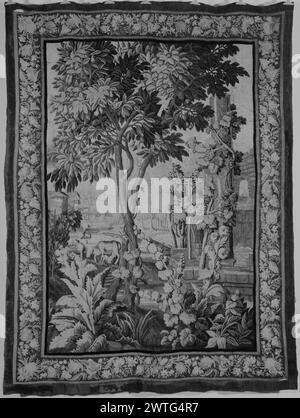 Cow feeding calf amidst vines. unknown c. 1700-1750 Tapestry Dimensions: H 9'9" x W 7'4" Tapestry Materials/Techniques: unknown Culture: French Weaving Center: Aubusson Ownership History: French & Co. purchased from Dr. Thomas Morrison, received 11/12/1964; sold to Mrs. H. J. Tasca 1/12/1968. Cow feeding calf reclining underneath, amongst flowering plants, thistle & trees; grape vine climbing up column & staked along wall of building in ruin (R); pond & buildings in background (BRD) floral border combined with acanthus leaves, pineapples & other fruit French & Co. stock sheet in archive, H-473 Stock Photo