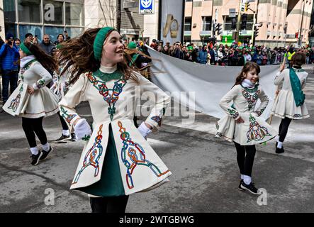 Montreal, Canada. 17th Mar, 2024. People participate in a parade to celebrate the St. Patrick's Day in Montreal, Canada, March 17, 2024. St. Patrick's Day is widely celebrated by Irish communities around the world. Credit: Andrew Soong/Xinhua/Alamy Live News Stock Photo