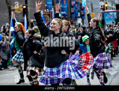 Montreal, Canada. 17th Mar, 2024. People participate in a parade to celebrate the St. Patrick's Day in Montreal, Canada, March 17, 2024. St. Patrick's Day is widely celebrated by Irish communities around the world. Credit: Andrew Soong/Xinhua/Alamy Live News Stock Photo