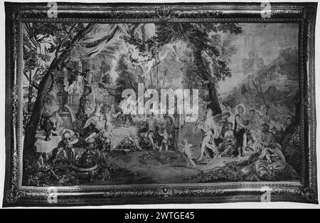 Feast on Mount Olympus. unknown c. 1710-1730 Tapestry Dimensions: H 12'7' x W 19'3' Tapestry Materials/Techniques: unknown Culture: Flemish Weaving Center: Brussels Ownership History: French & Co. purchased from Charles 3/26/1917. In wooded landscape, gods attend large banquet (L); gods playing musical instruments, including Orpheus (?) playing lyre & Pan playing pipes (BRD) picture-frame border with acanthus scroll ornament French & Co. stock sheet in archive, 21402 Stock Photo