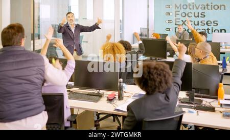 Team work celebrating good news in the coworking office Stock Photo