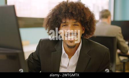 Happy african american man smiling at camera Stock Photo