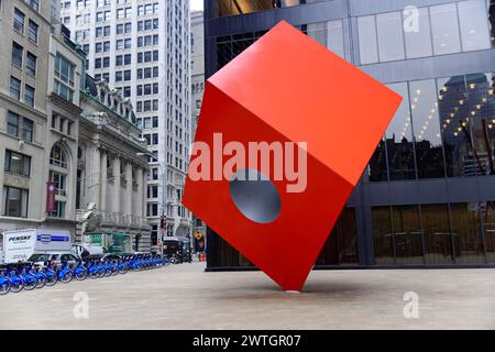 Geometric red sculpture with circular cut-out in front of modern building, Manhattan, New York City, New York, USA, North America Stock Photo