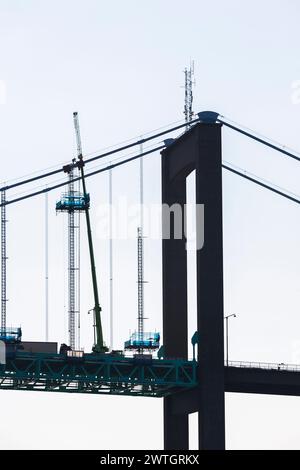 Work on a bridge with lifts in silhouette Stock Photo