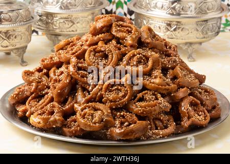 Plate with traditional Moroccan fresh baked chebakia close up on the table for ramadan Stock Photo