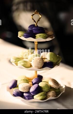 colorful macrons on tiered display Stock Photo
