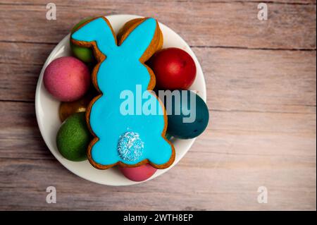 Easter gingerbread cookie on  wooden table. Bunny shaped cookies for Easter Stock Photo