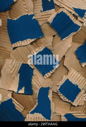 Texture from pieces of torn colored cardboard. Blue brown carton background. Recycling concept. Rough pieces ripped corrugated ribbed blue cardboard Stock Photo