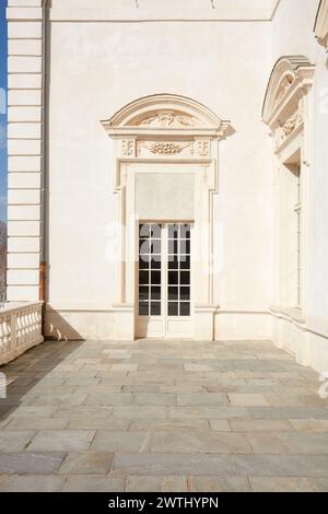 VENARIA REALE, ITALY - MARCH 29 , 2023: Reggia di Venaria architecture with white portal and terrace in spring sunlight Stock Photo