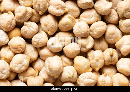 Uncooked dried chickpeastexture background. Heap of legume chickpea background Stock Photo