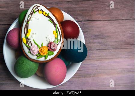 Easter gingerbread cookie on  wooden table. Egg shaped cookies for Easter Stock Photo
