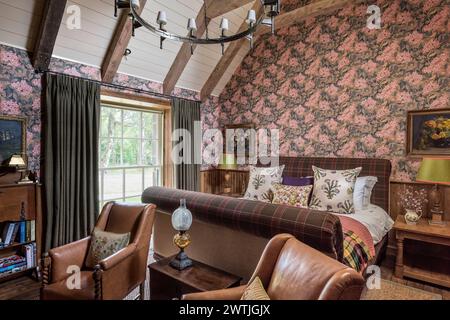 Patterned floral wallpaper in bedroom of luxury hotel in Ardfin on the Isle of Jura, Inner Hebrides, Scotland, UK Stock Photo