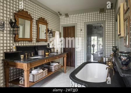 Pair of antique mirrors above wash stand in luxury hotel in Ardfin on the Isle of Jura, Inner Hebrides, Scotland, UK Stock Photo