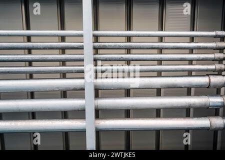 Communication pipes under the bridge support station platform, ceiling with water supply and drainage. Stock Photo