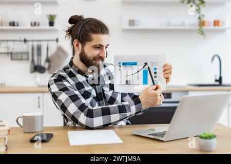 Caucasian worker providing statistical analysis using modern technologies. Stock Photo